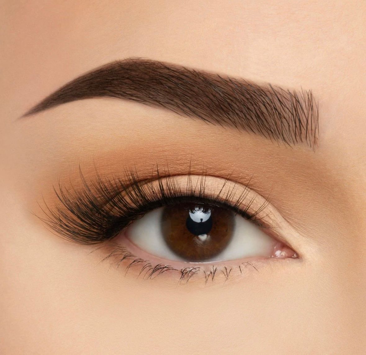 A close up of a woman 's eye with makeup on.