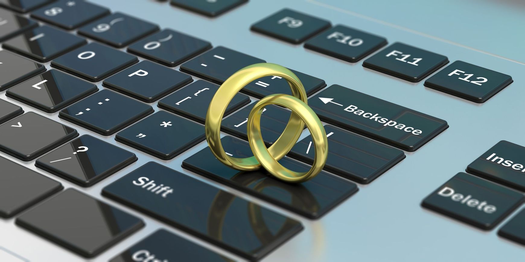 Two Wedding Rings Are Sitting on Top of a Computer Keyboard | Sydney, NSW | Online Divorce Australia
