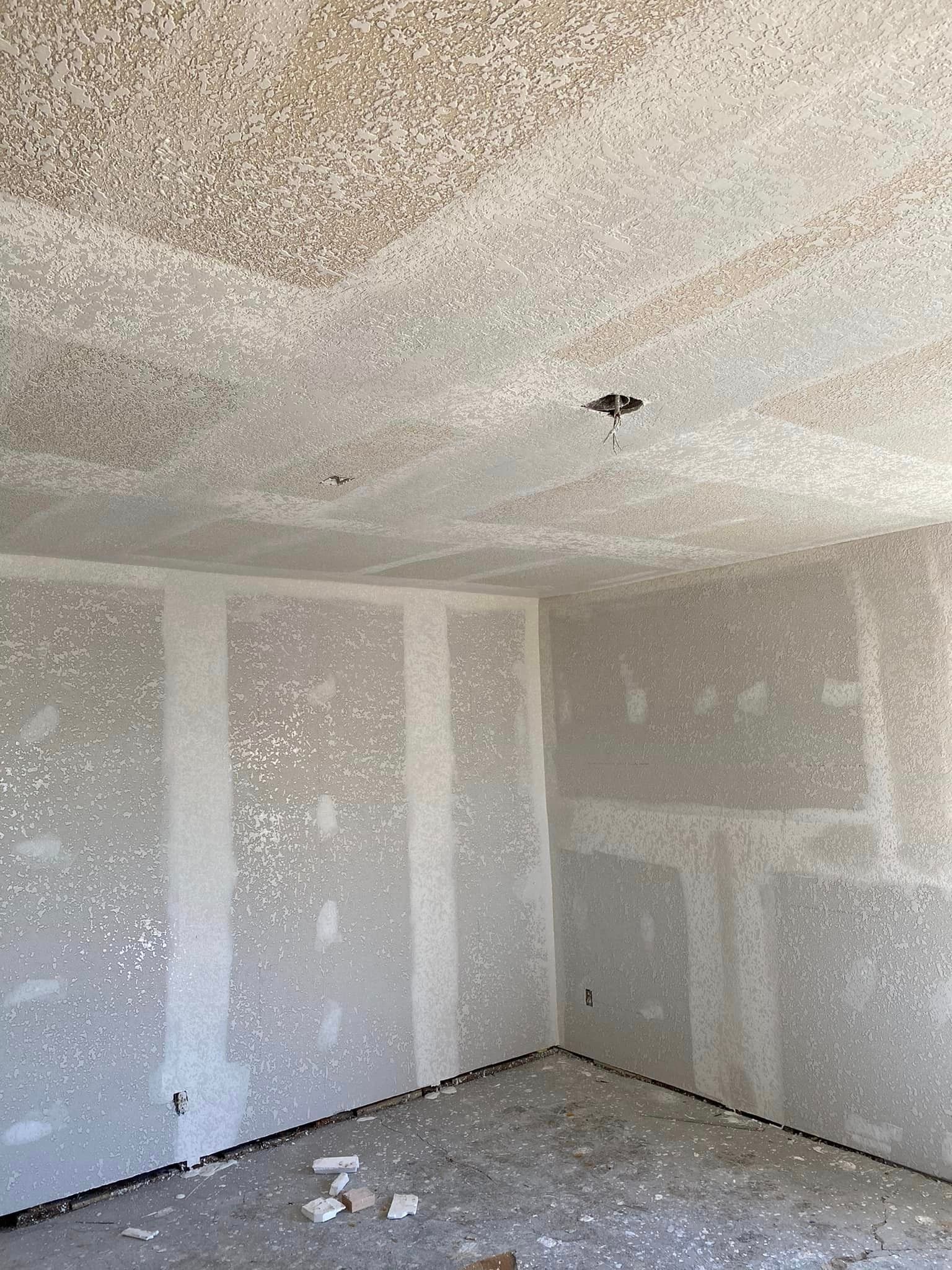 A room with drywall on the walls and ceiling.