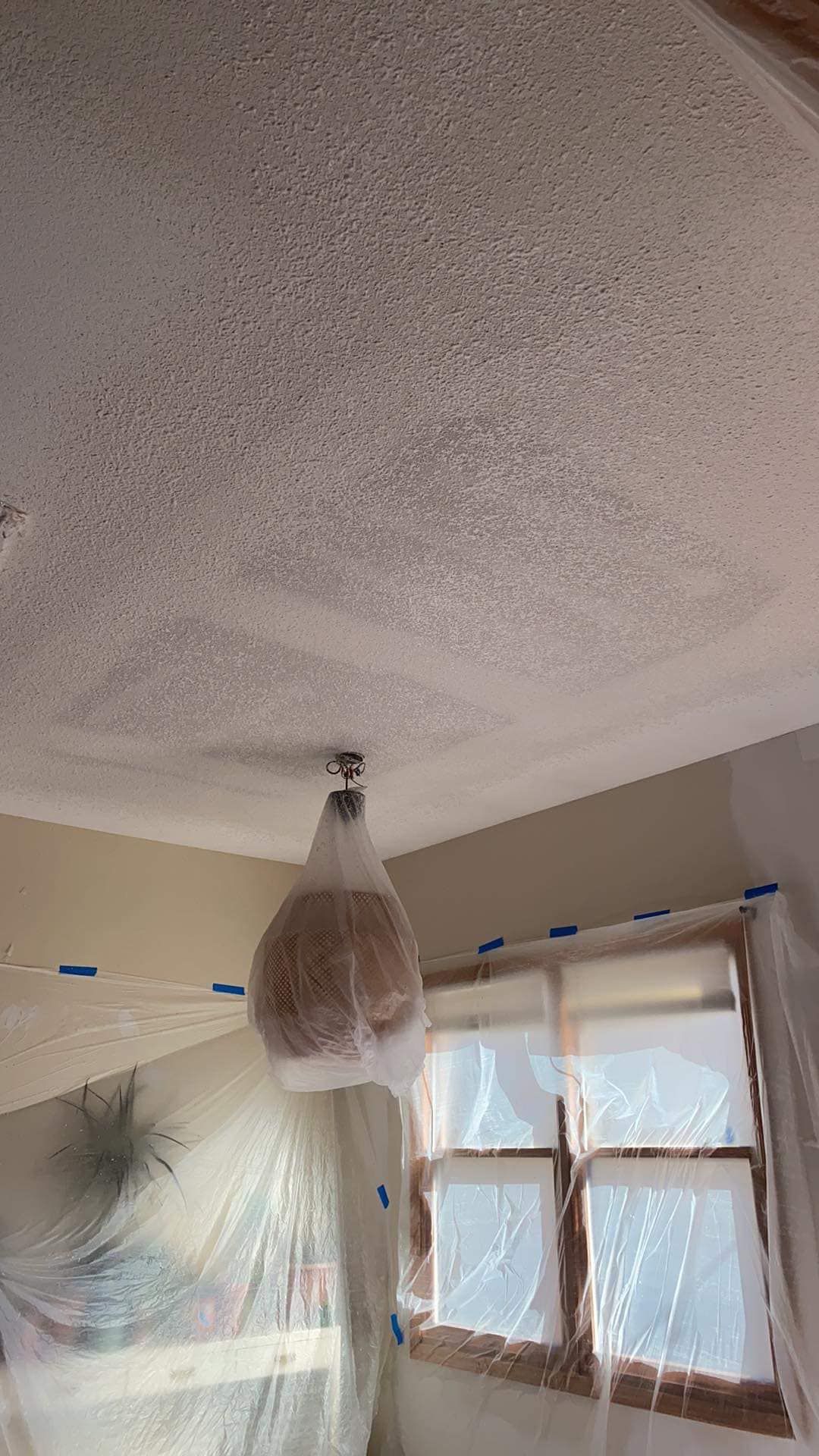 A room with a ceiling that is covered in plastic.