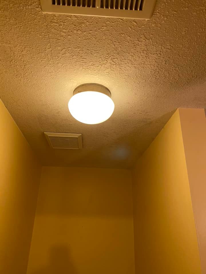 There is a light on the ceiling of a room.