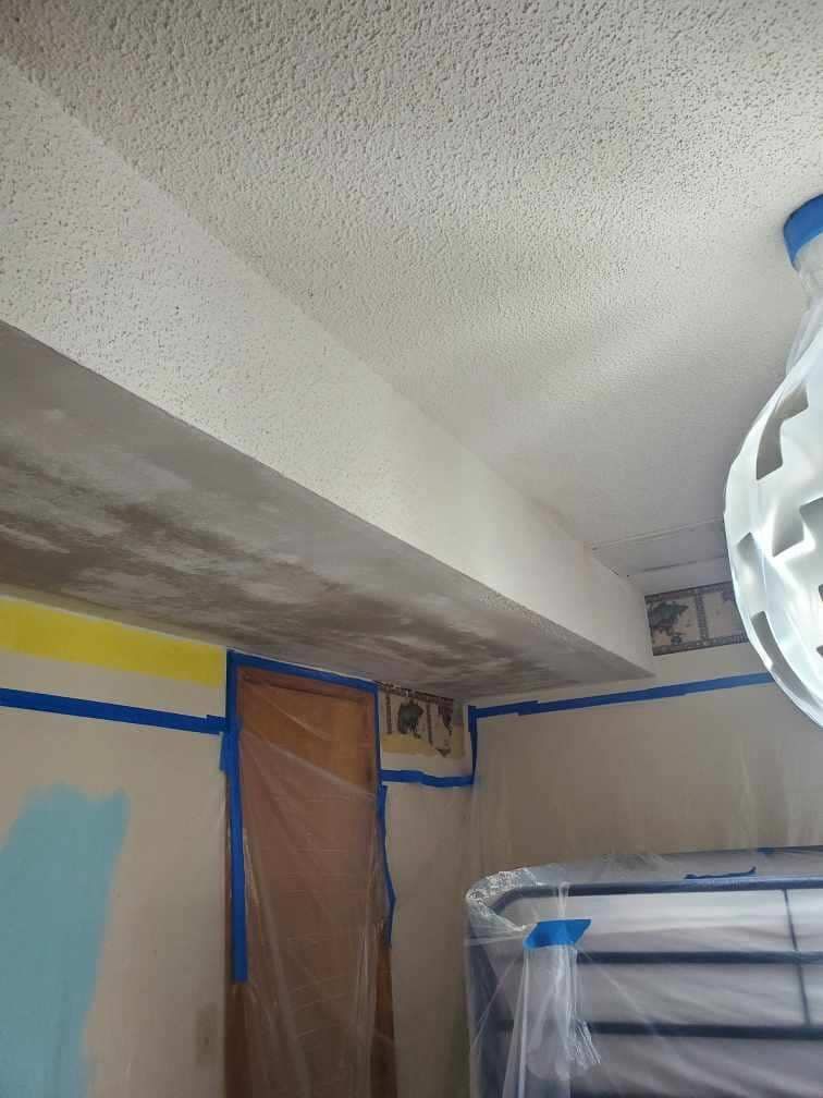 A room with a ceiling that is covered in plastic.