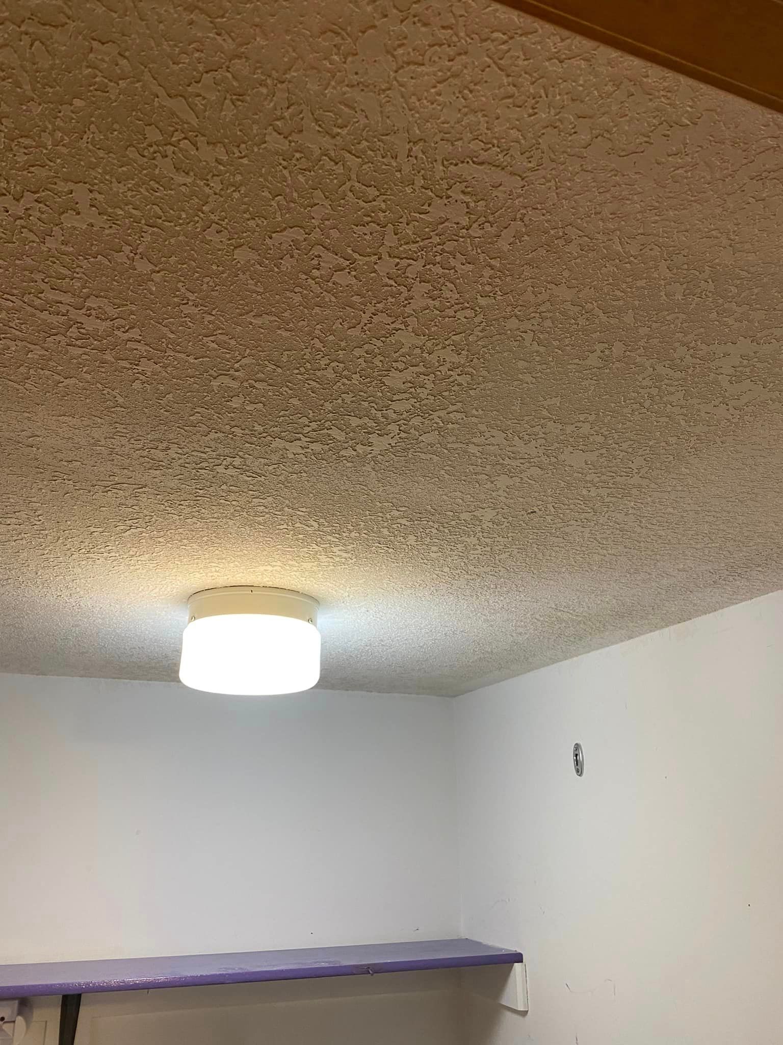 There is a light on the ceiling of the room.