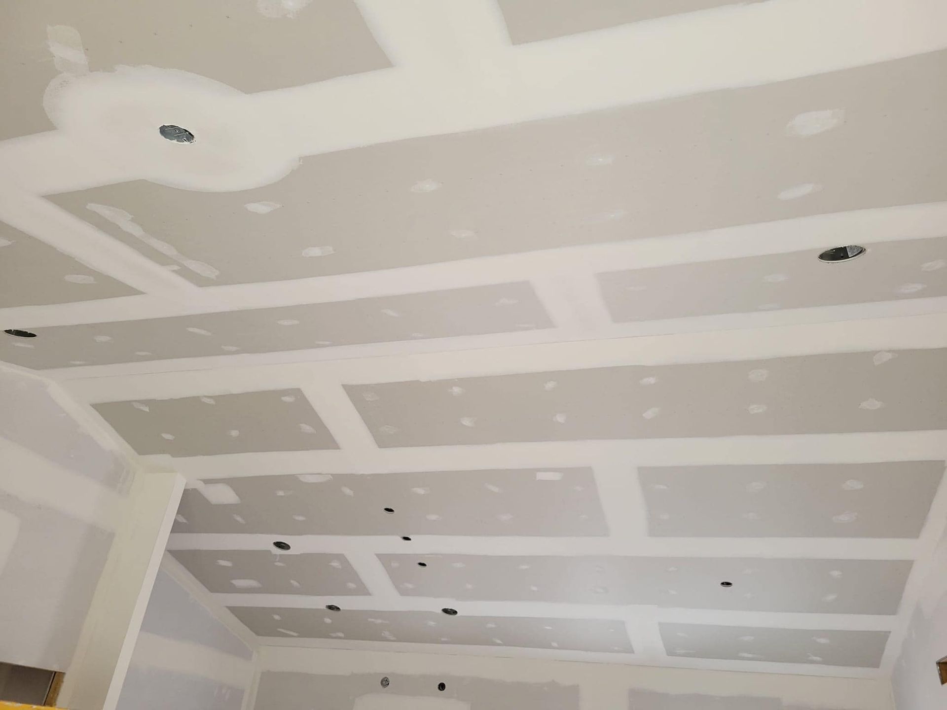 A room with a ceiling that is being remodeled.