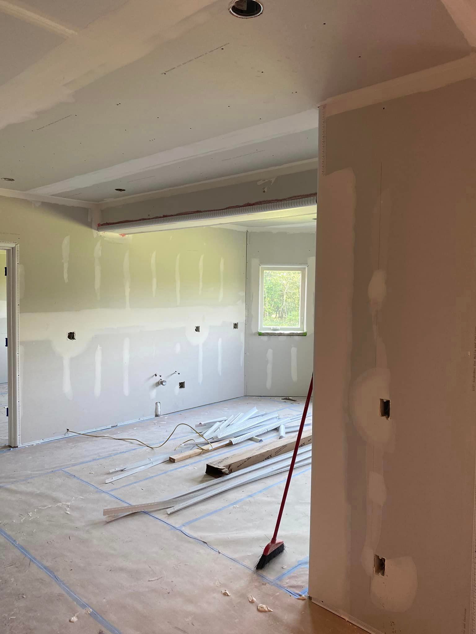 There is a broom in the middle of the room.