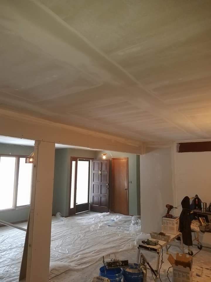 A room with a ceiling that is being painted
