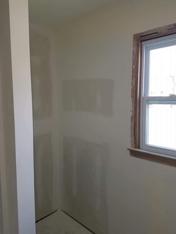 There is a window in the corner of the room.