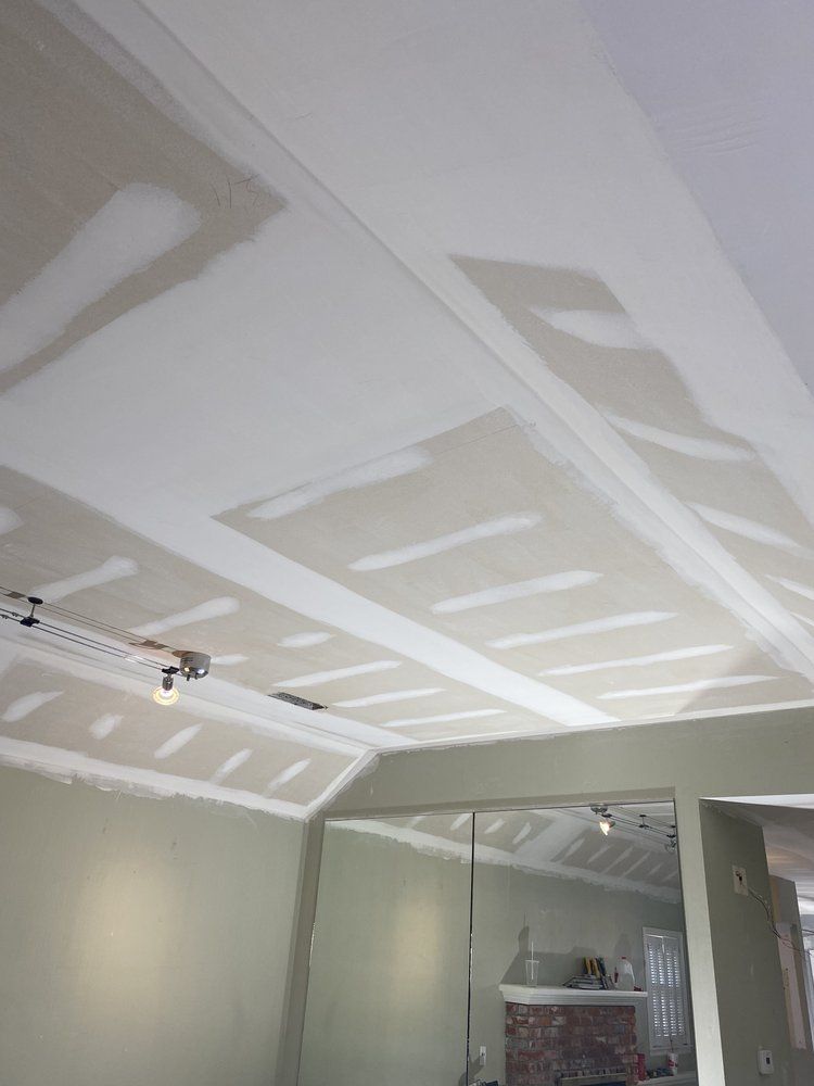 A room with a ceiling that has a lot of holes in it