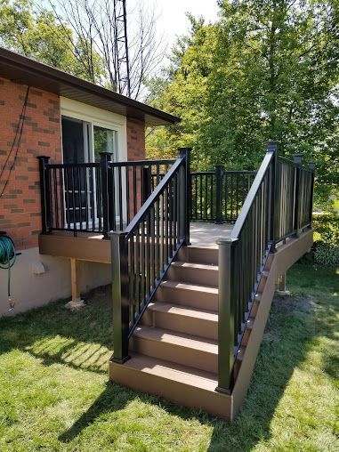 There is a deck with stairs leading up to it.
