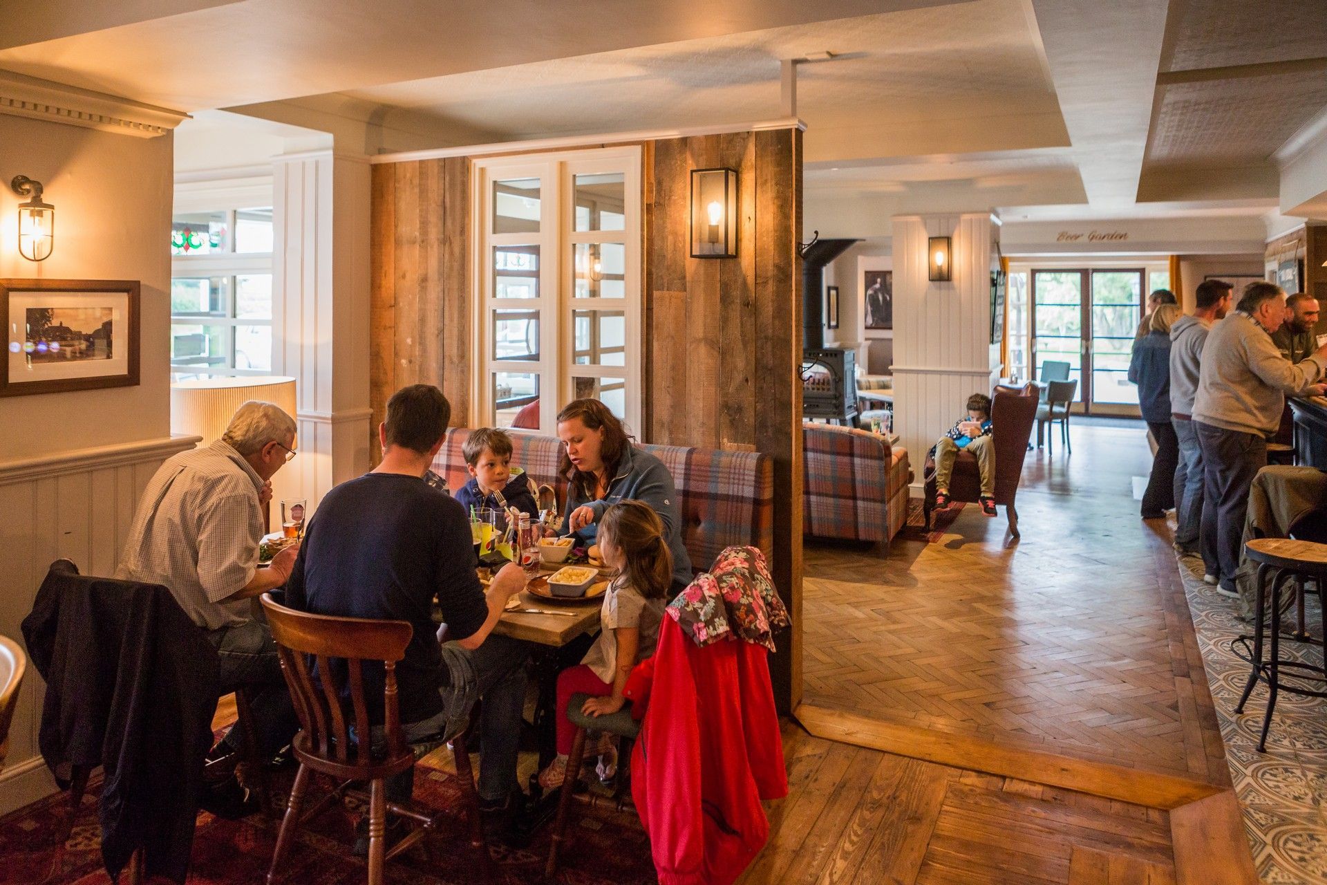 The King Charles, Winchester | A group of people are sitting at tables in a restaurant.