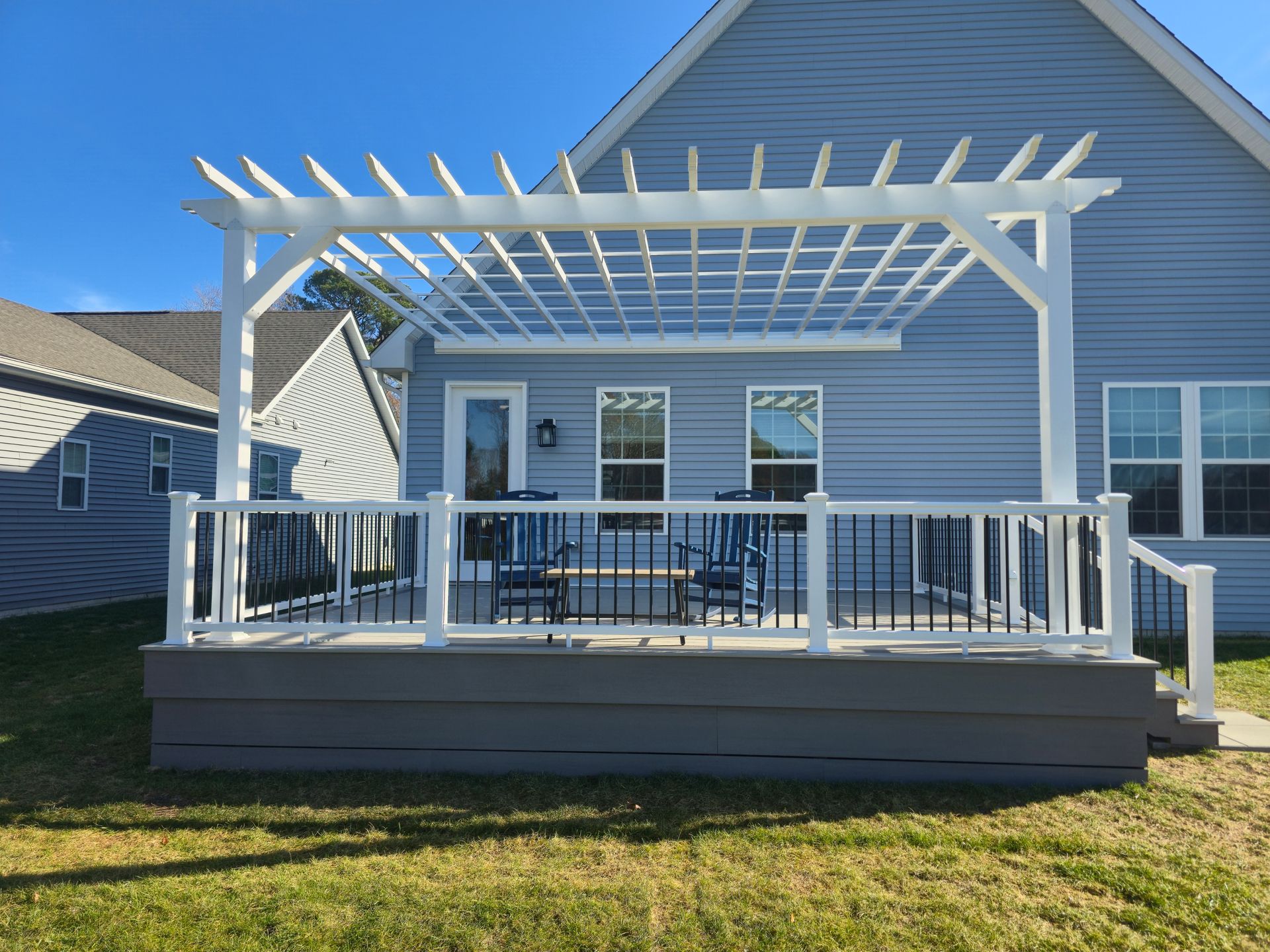 A deck with a hot tub on top of it