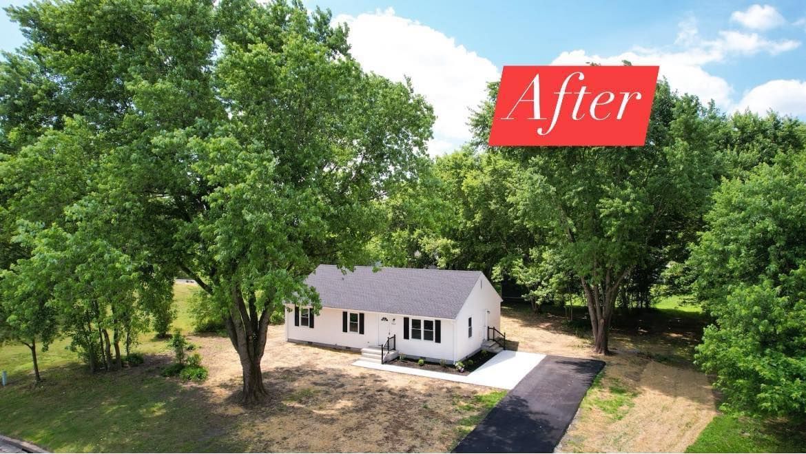 An aerial view of a house with a sign that says after