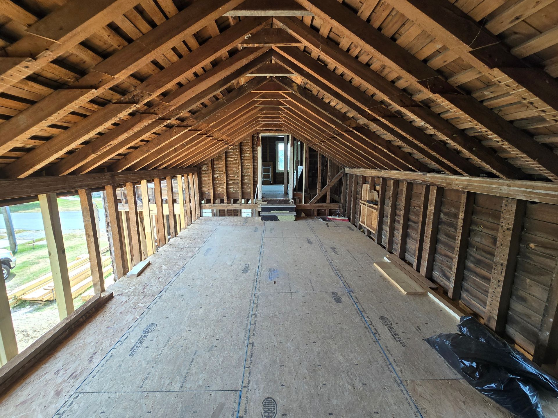An attic with a roof that is being built