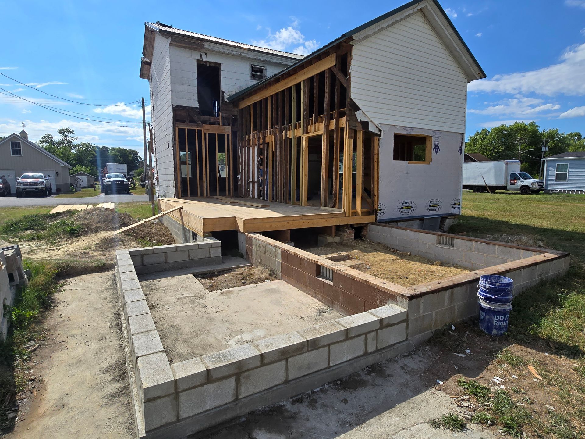 A house that is being built with a lot of bricks.