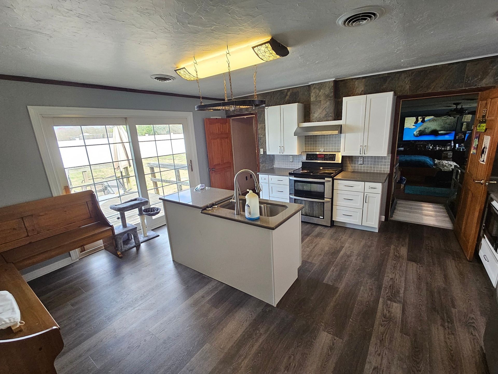 A kitchen with a large island in the middle of the room.