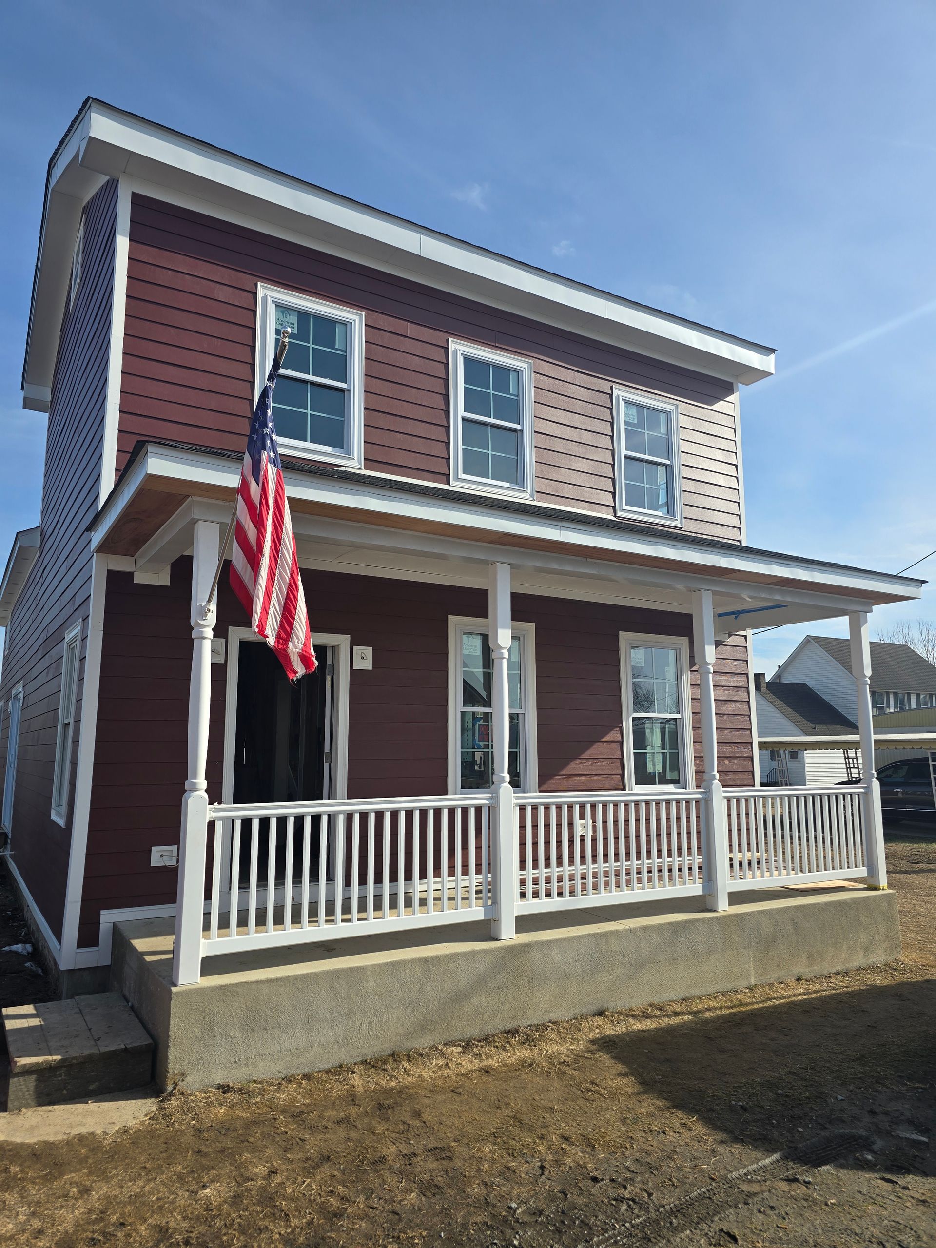 A house with an american flag on the porch
