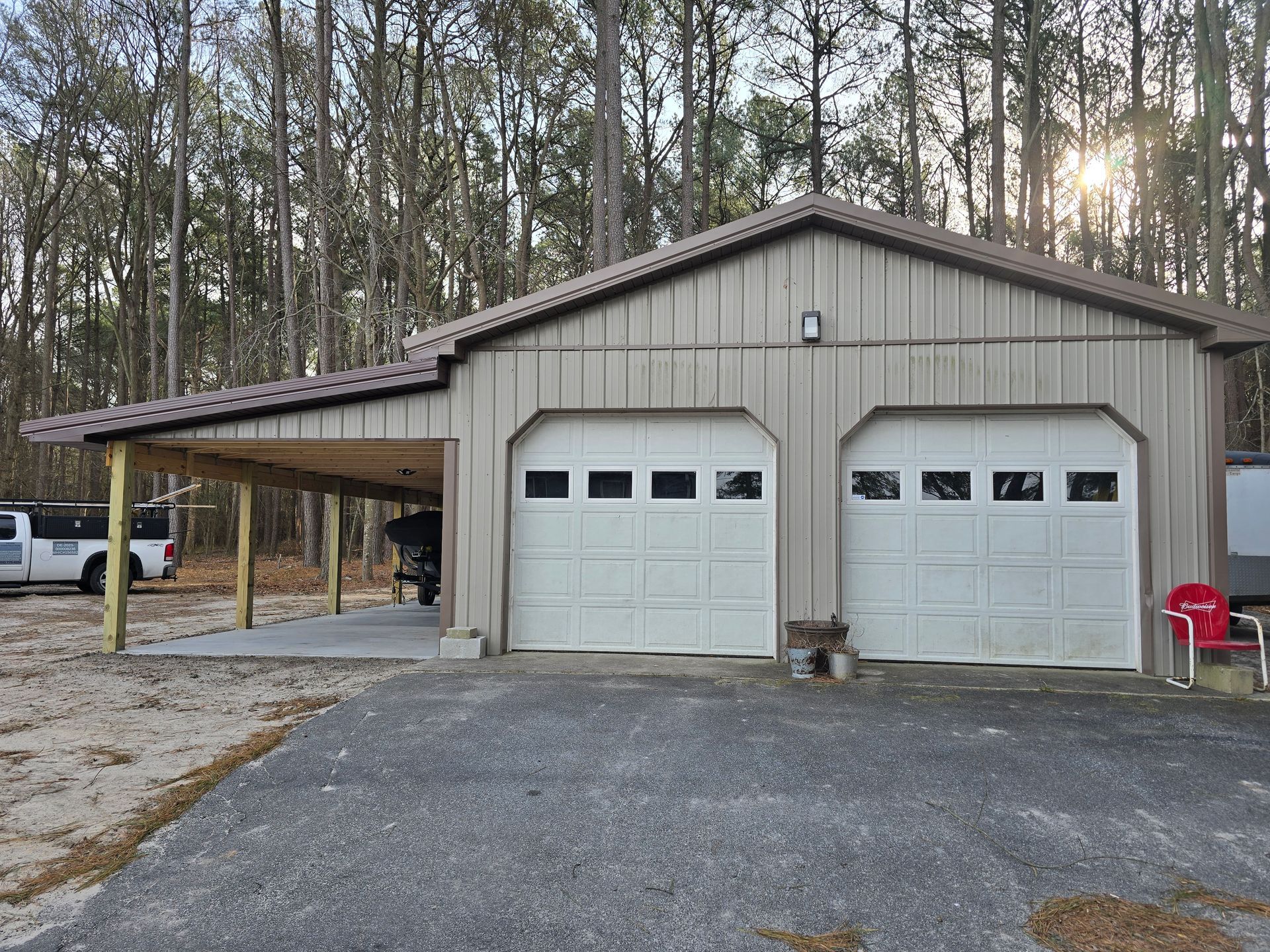 A kitchen with a stove , microwave , refrigerator and cabinets.