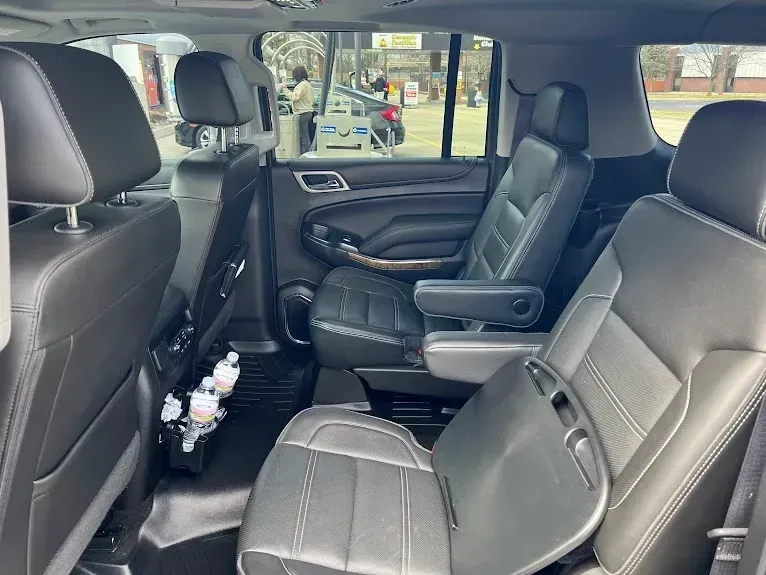 The back seat of a suv with a lot of seats.