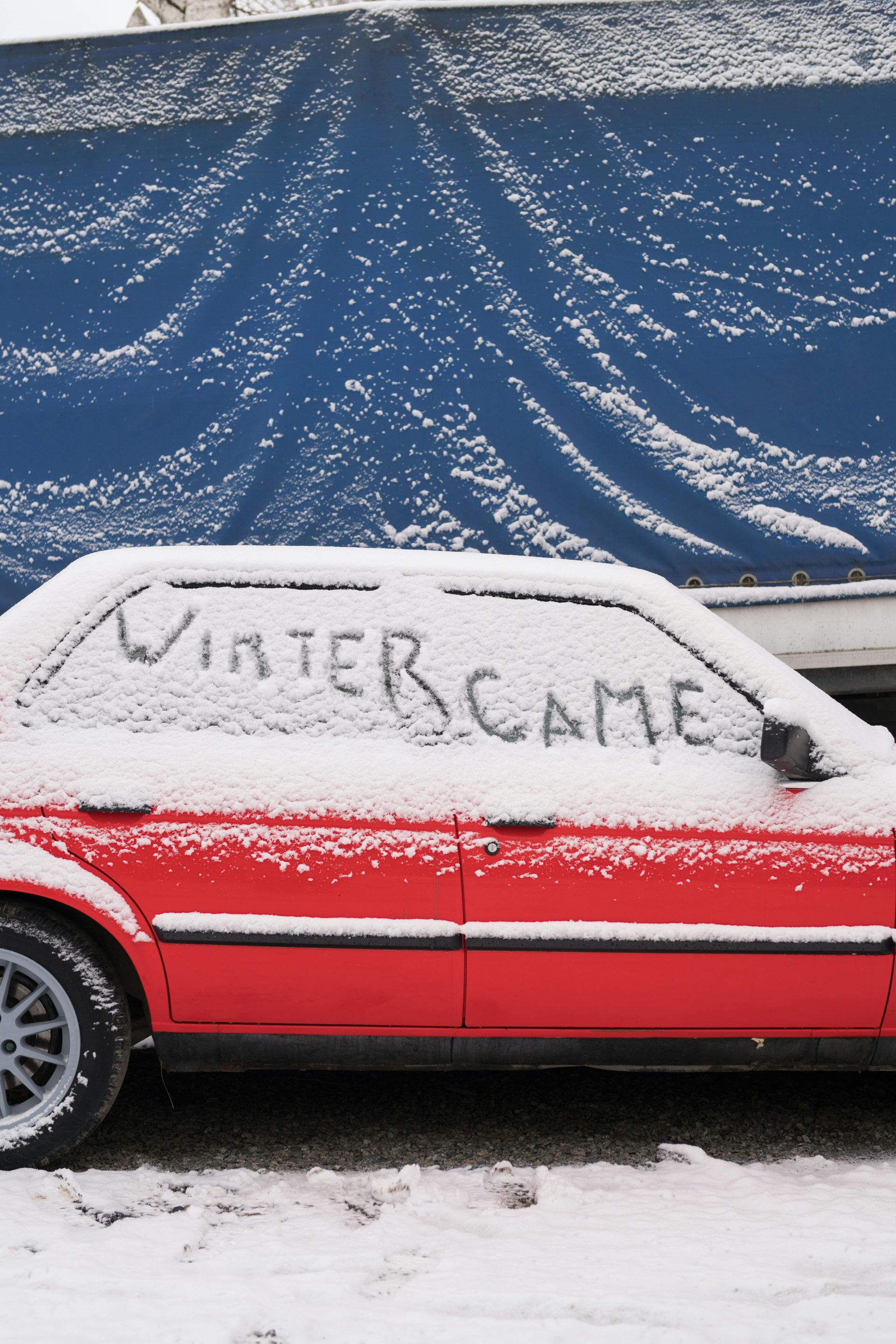 red car in snow