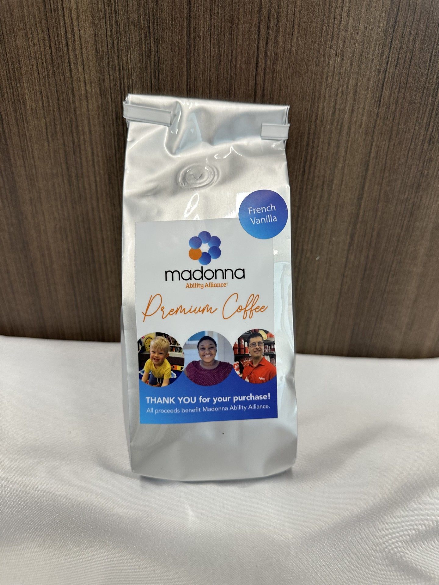 Silver coffee bag with blue and white label; 