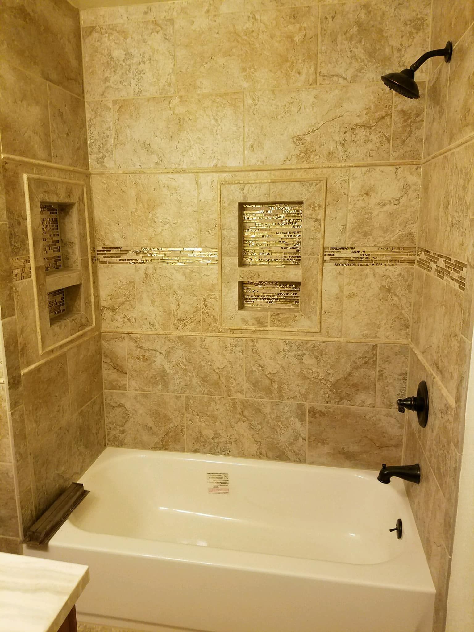 A bathroom with a bathtub and a shower.