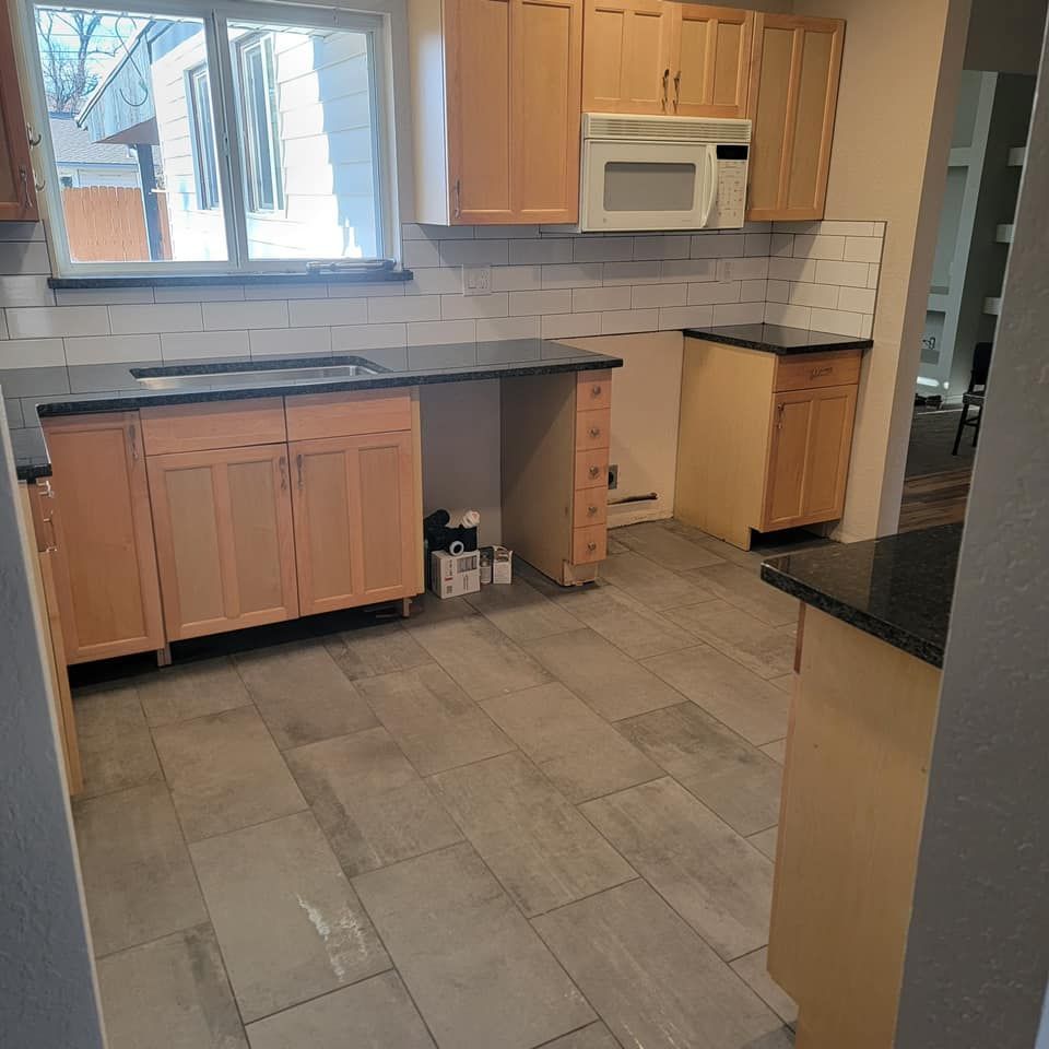 a kitchen with luxury vinyl tile flooring 