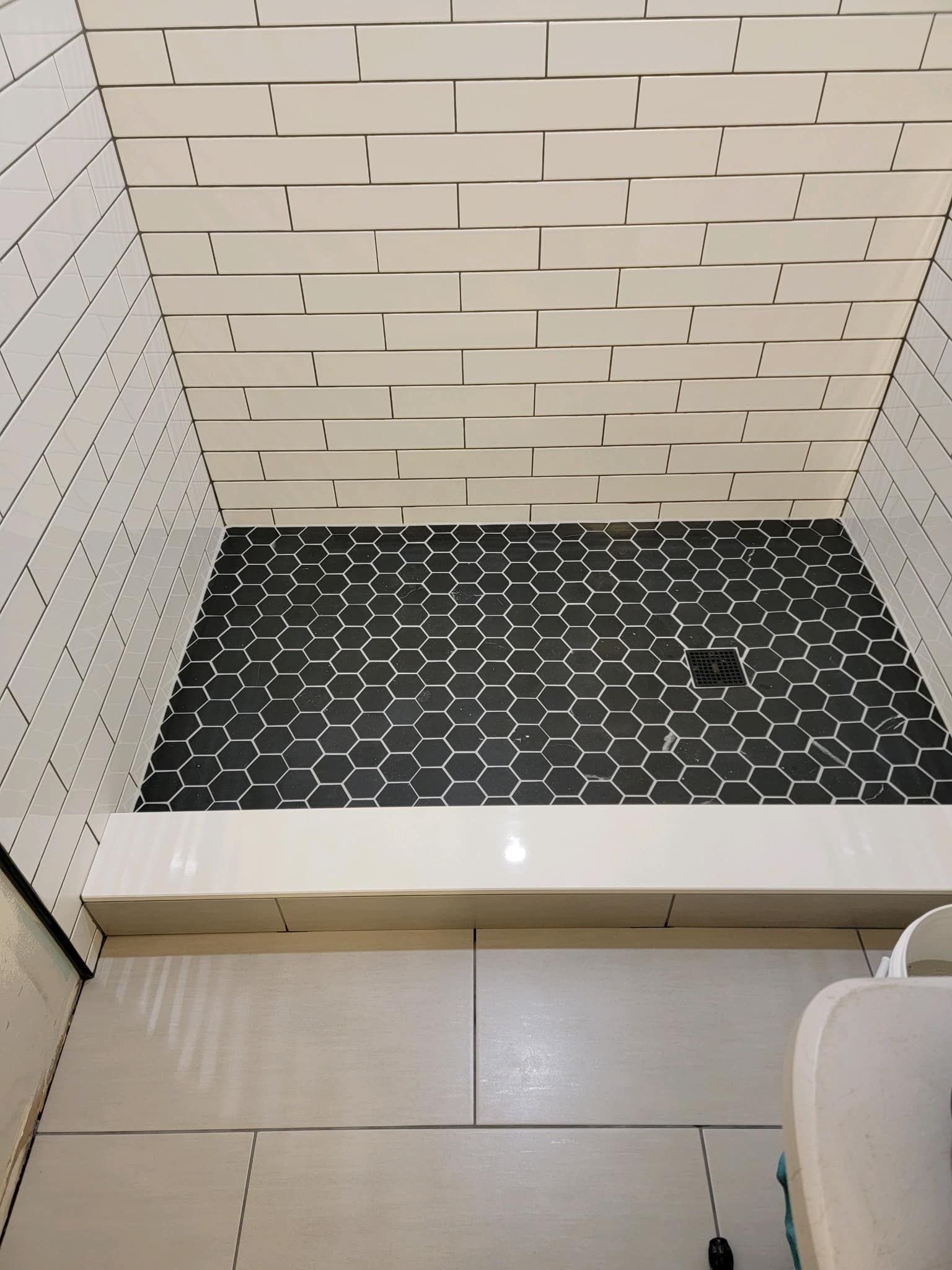 a bathroom with a walk in shower and a toilet