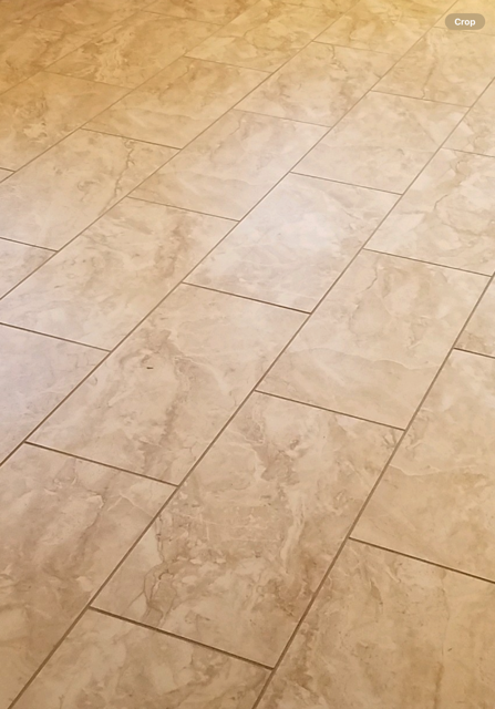 a close up of a tiled floor with a marble texture .