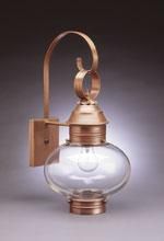 Copper outdoor wall lantern with clear glass globe, arched arm, and square mounting plate.