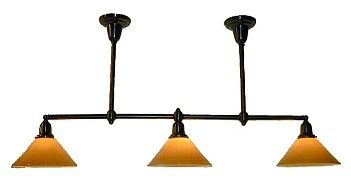 Three-light bronze chandelier with amber glass shades, hanging from a ceiling.