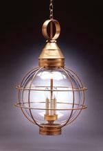 Brass hanging lantern with a clear glass globe and protective cage.