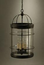 Black metal and glass pendant light with three bulbs.