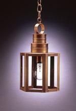 Copper pendant lamp with open rectangular cage design, lit bulb, hanging from a chain.