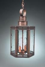 Bronze hexagonal pendant light with clear seeded glass panels, two candle-shaped bulbs.