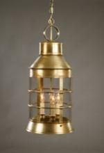 Brass pendant lantern with clear glass panels, hanging from a chain.