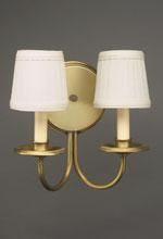 Gold wall sconce with two off-white shades.