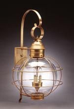 Golden wall-mounted outdoor lantern with a globe-shaped glass enclosure and a decorative cage.