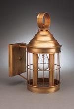 Copper outdoor wall-mounted lantern with exposed bulb, cage design, and circular handle on a neutral background.