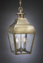 Gold-toned outdoor hanging lantern with seeded glass panels, holding two decorative candle-shaped bulbs.