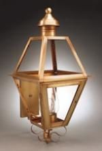 Copper outdoor lantern with geometric glass panes and decorative base.
