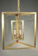 Gold square lantern pendant with seeded glass panels.