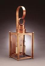 Copper lantern with curved handle and two candle-shaped lights inside a rectangular frame.