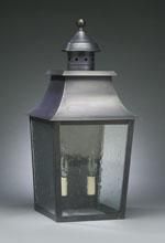 Dark metal outdoor lantern with glass panels.
