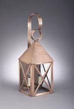 Copper lantern with a peaked roof and curved handle.
