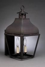 Dark bronze outdoor wall lantern with two light bulbs.