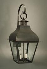 Wall-mounted lantern with a dark metal frame, glass panels, and two visible light bulbs.