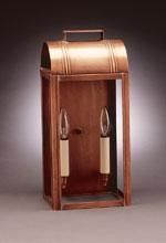 Copper outdoor wall lantern with two candle-style bulbs, mounted on a wall.