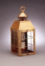Brass-colored lantern with a glass pane, a lightbulb, and a loop at the top, against a neutral background.