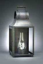 Metal lantern with glass lamp inside.