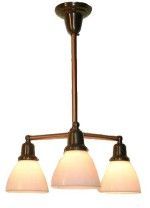 Bronze chandelier with three frosted glass shades.